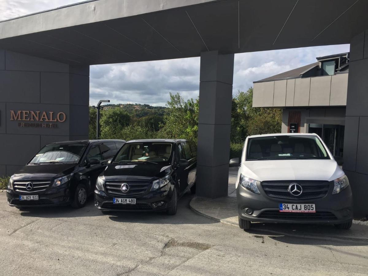 Menalo Hotel Premium Istanbul Airport Zewnętrze zdjęcie The photo shows three Mercedes-Benz vehicles parked in front of a building with a sign that reads "MENALO." The vehicles include two black vans and one white van. The building behind them appears modern, set amidst greenery.